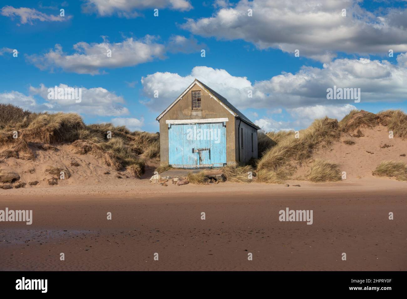 Old boat shed on the beach at the coastal village of Newburgh, Aberdeenshire, Scotland Stock Photo