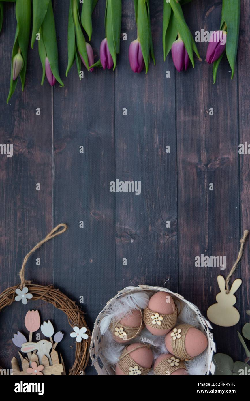 A high angle view of easter decorations and tulips Stock Photo