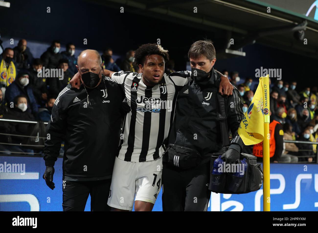 Villarreal, Spain, 22nd February 2022. Weston McKennie of Juventus reacts as he is accompanied from the field of play by Nikos Tzouroudis Juventus First Team Doctor ( left ) and Phyisiotherapist Francesco Pieralisi ( right ) after picking up a serious foot injury following a challenge by Pervis Estupinan of Villarreal CF during the UEFA Champions League match at Estadio de la Ceramica, Villarreal. Picture credit should read: Jonathan Moscrop / Sportimage Stock Photo