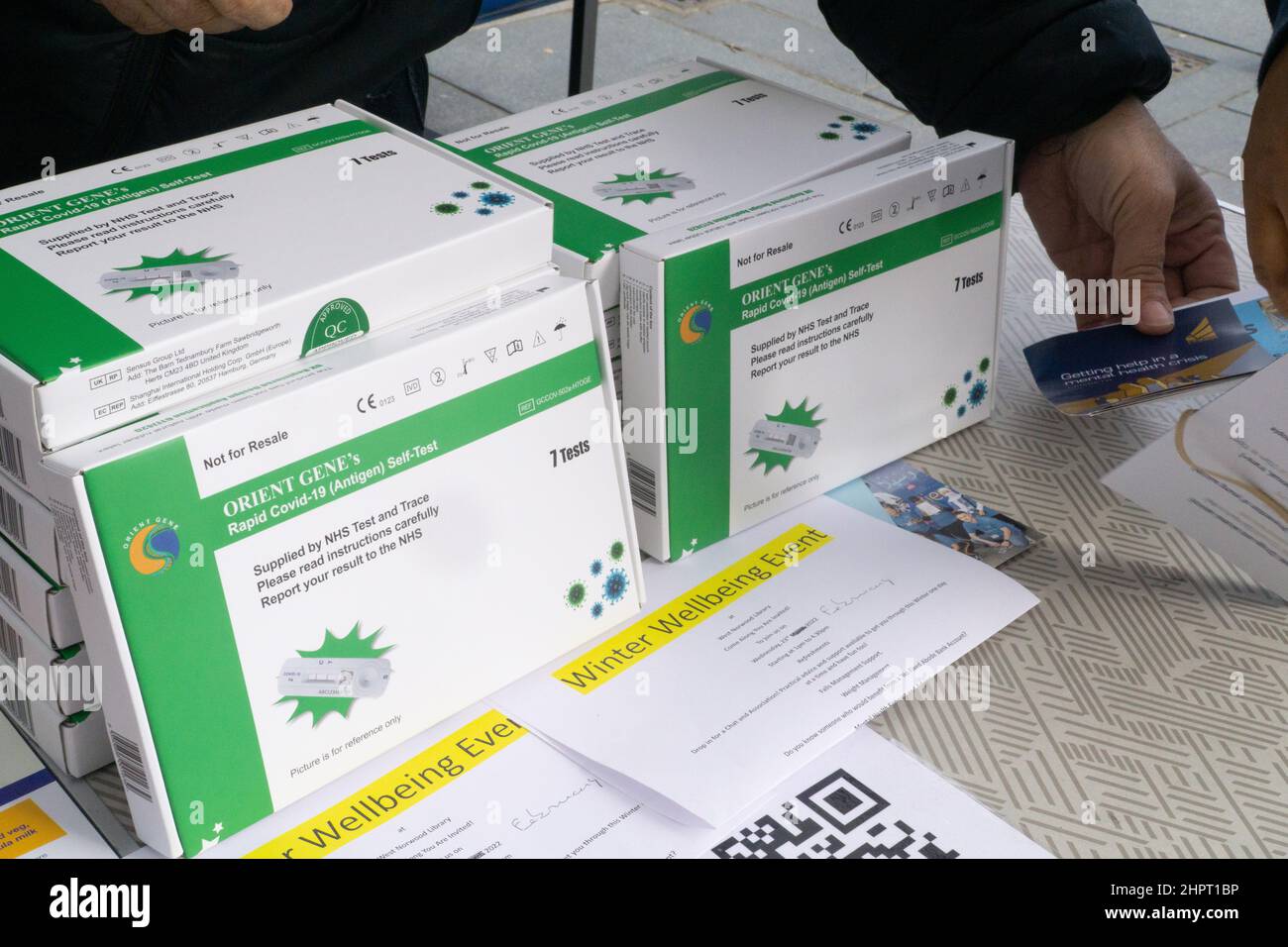 London, UK, 23 Feb 2022: A stack of lateral flow tests which are being given out to Lambeth residents at a pop-up vaccination and testing site opposite Brixton tube station. Since Boris Johnson announced that free testing will end on 1 April there has been high demand and test were temporarily unavailable to order online. Anna Watson/Alamy Live News Stock Photo