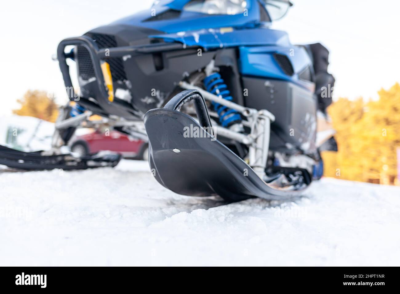 Snowmobile in winter conditions. Snowmobiling in winter in the north. Extreme kind of winter outdoor sport. Stock Photo