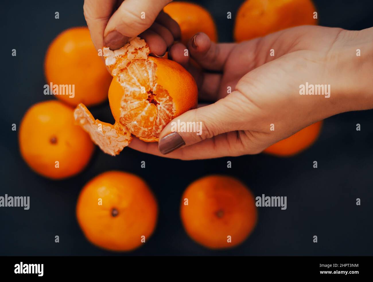 Fingers peel orange from peel hi-res stock photography and images - Alamy