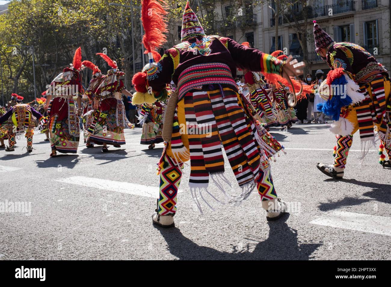 Bolivian dancers in traditional outfits perform folk dance during Dia de la Hispanidad (Hispanic Heritage Day) in Barcelona, Spain. Stock Photo