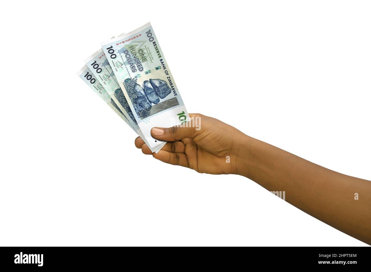 Fair hand holding 3D rendered 100 Zimbabwean dollar notes isolated on white background Stock Photo