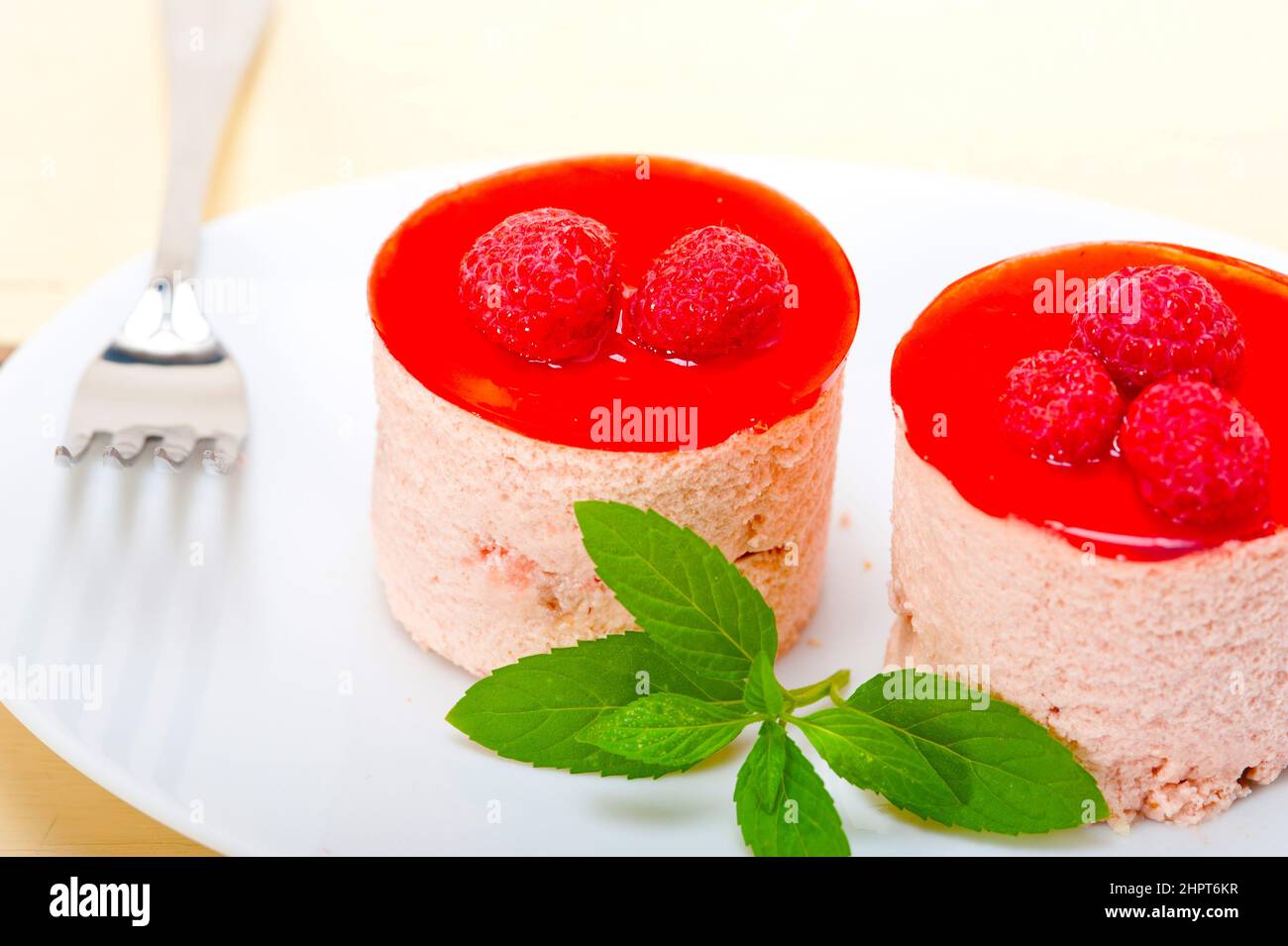 Round Raspberry Sweets fresh raspberry cake mousse dessert round shape with mint leaves Stock ...