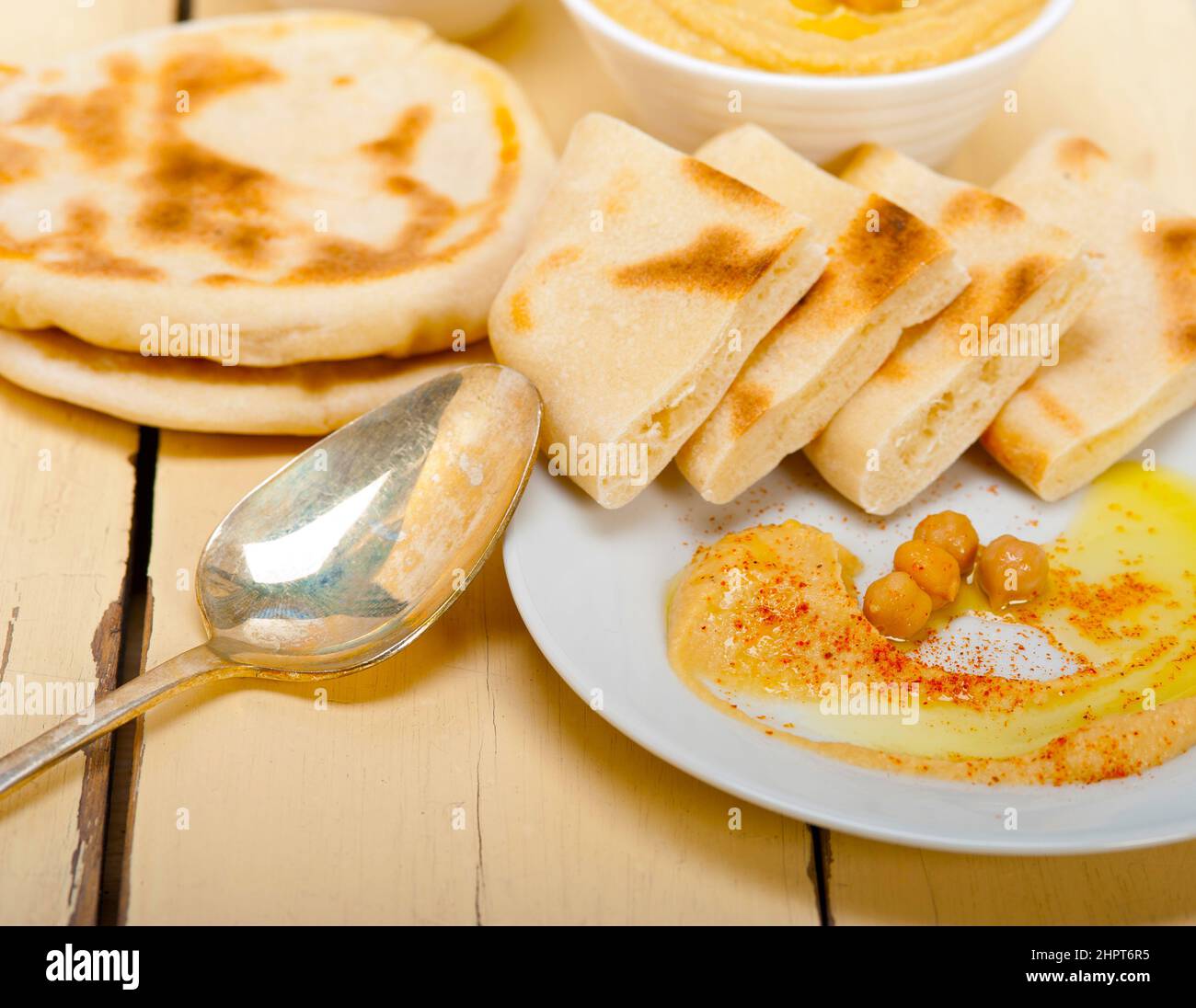 traditional chickpeas Hummus with pita bread and paprika on top Stock