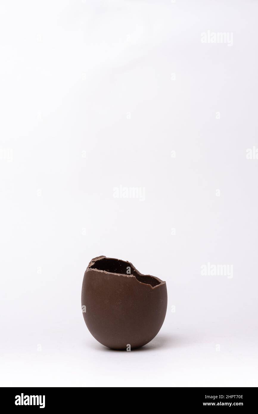 Chocolate easter egg with the top broken off Stock Photo - Alamy