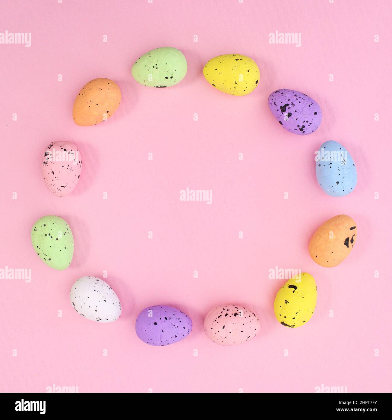 Creative circle copy space frame for Easter made with eggs on pastel pink background. Flat lay minimal. Stock Photo