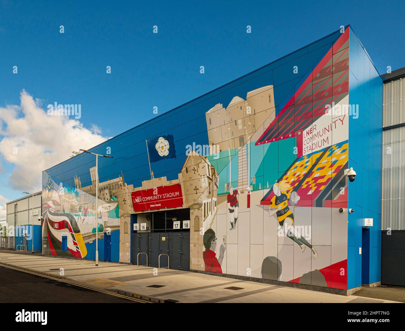 Colourful mural on the exterior of the West stand of the LNER Community Stadium in York. Stock Photo