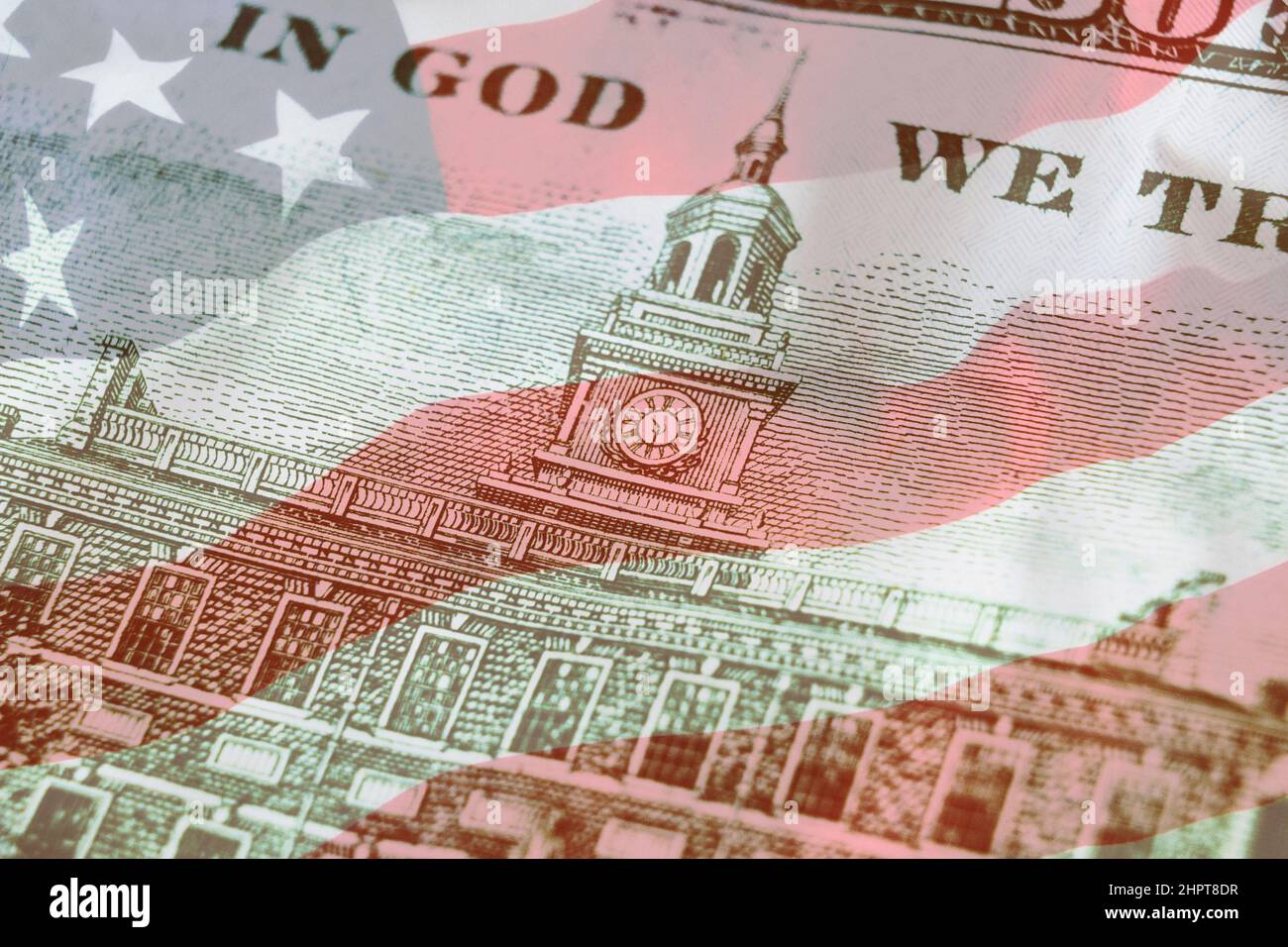 Independence Hall on back side 100 dollars banknote with american flag background. 100. Economy, savings and the US dollar Stock Photo