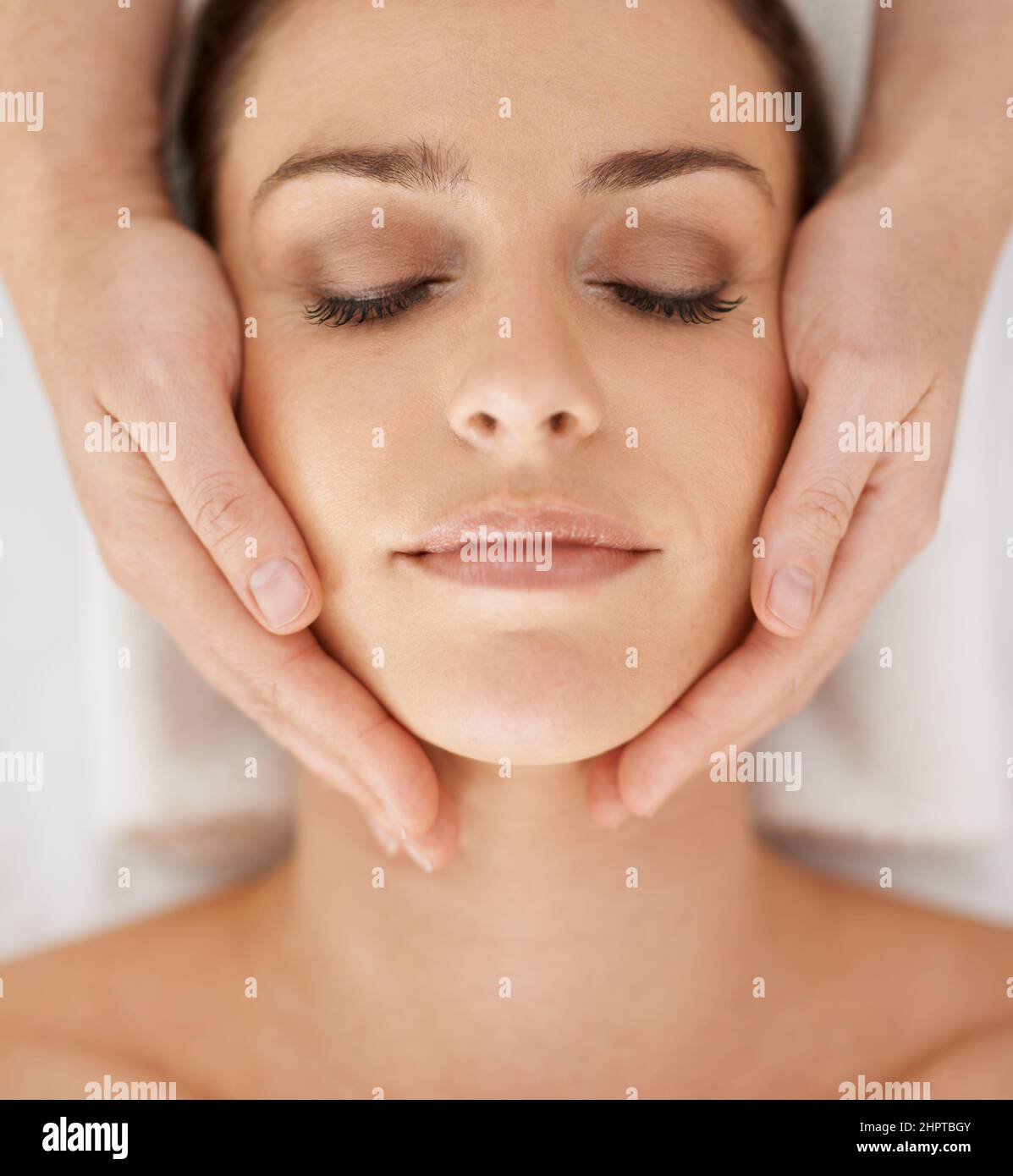 Releasing the weeks stress. Cropped shot of a gorgeous young woman enjoying a massage. Stock Photo