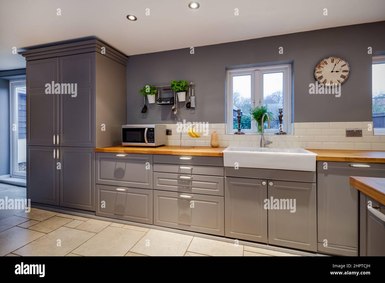 Traditional Looking Kitchen With Fitted Cabinets Butler Sink And traditional-looking-kitchen-with-fitted-cabinets-butler-sink-and