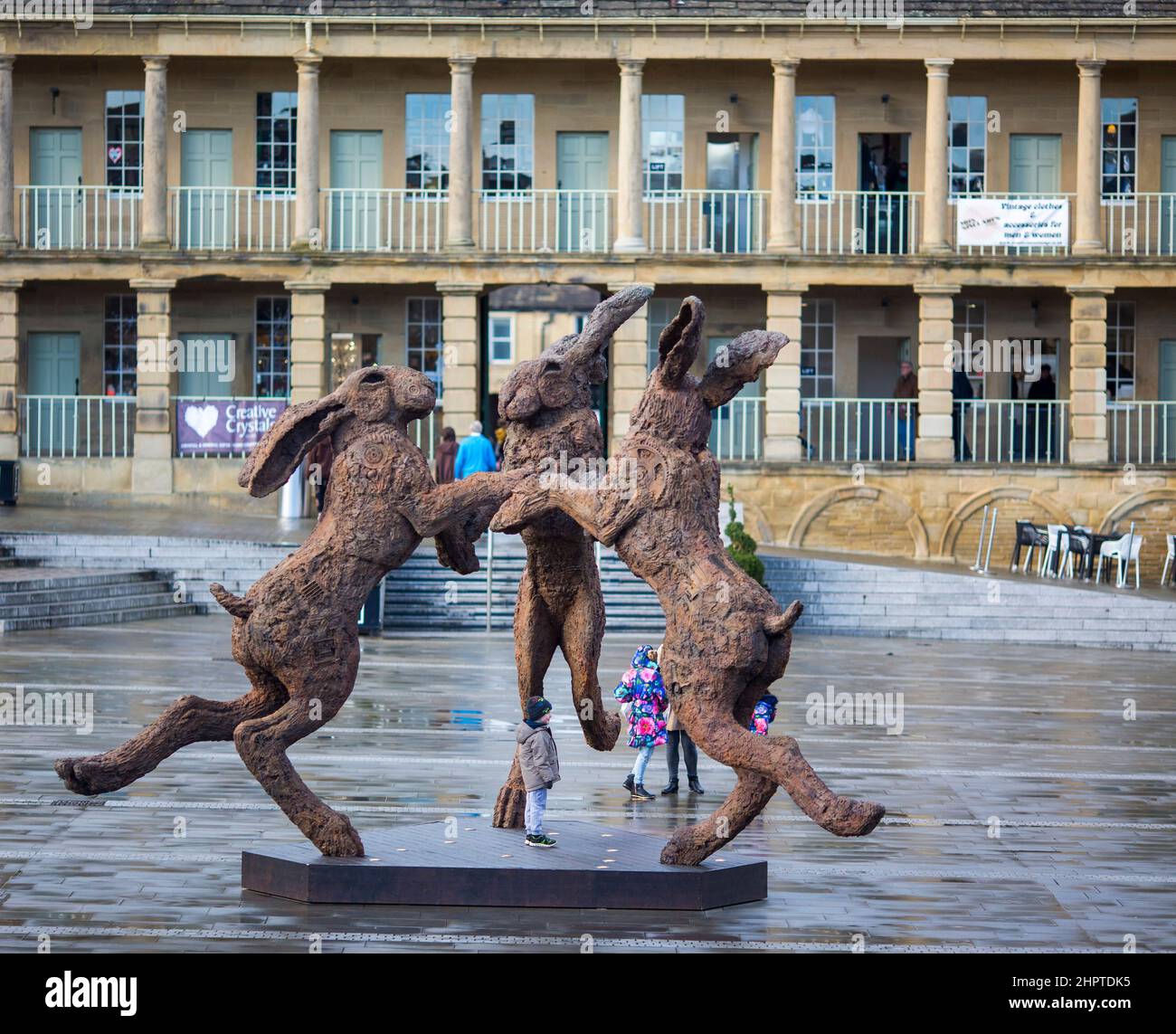 West Yorkshire, UK. 23rd Feb, 2022. The Sophie Ryder installation at The Piece Hall The Piece Hall courtyard is hosting a UK first when a selection of sculptures by world renowned artist Sophie Ryder go on display in Halifax from February. The six pieces will include the 4.5m high ‘Dancing Hares’, which has never been exhibited publicly in the UK before. The sculptures will be positioned around the 66,000 sq ft courtyard until 23 May where they can be viewed by the public free of charge.  Sophie “works big” and her imposing sculptures which are inspired by animals and mystical creatures . Stock Photo