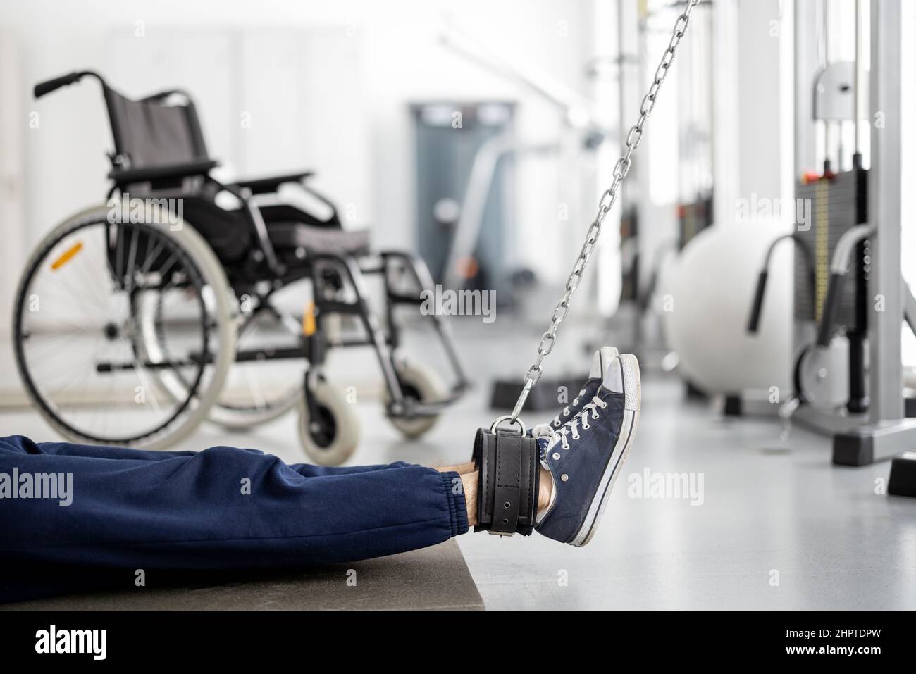 Man doing exercises on decompression simulators for recovery Stock Photo