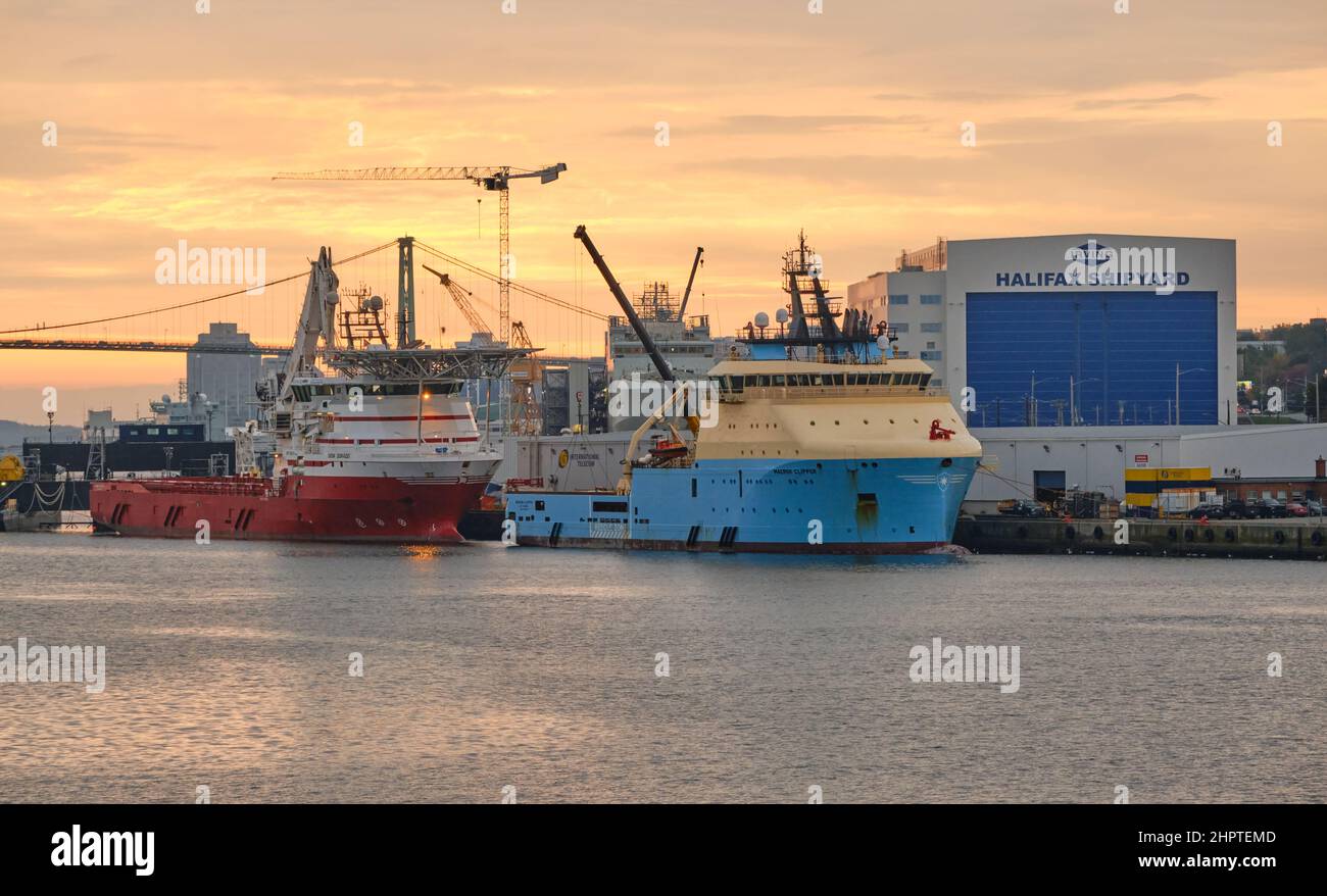 The Irving Halifax Shipyard building, with two ships anchored in