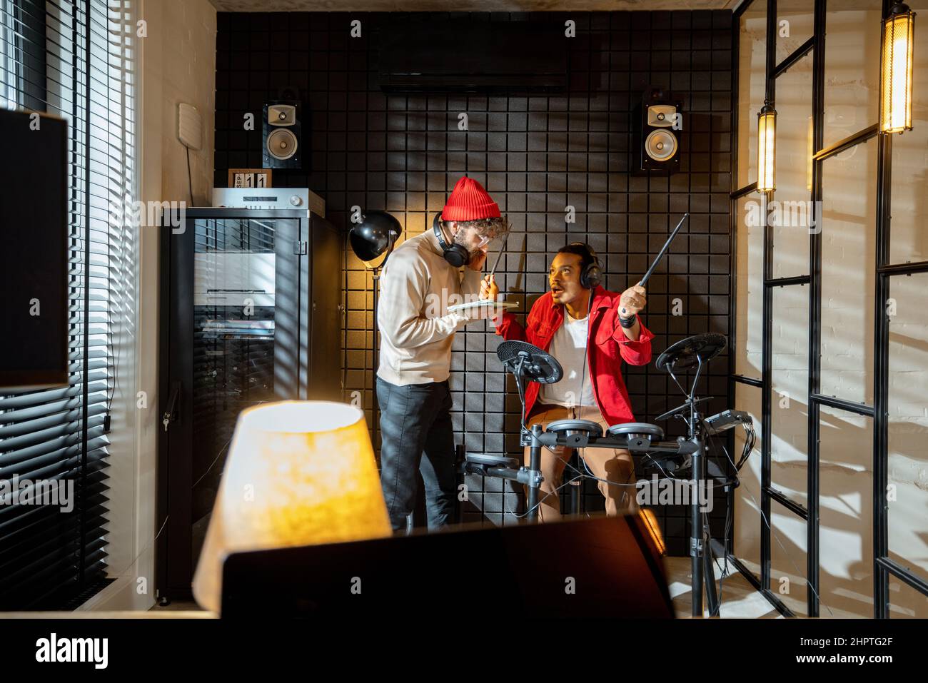 Men playing electric drums at home sstudio Stock Photo