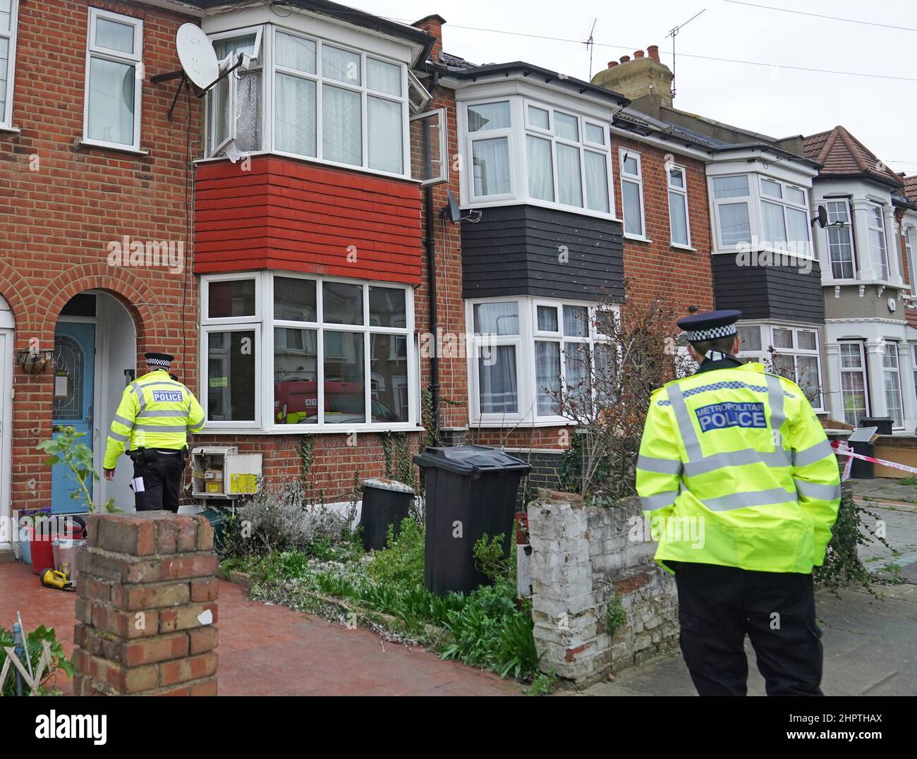 Police officers at the scene of a house fire on Windsor Road, Ilford