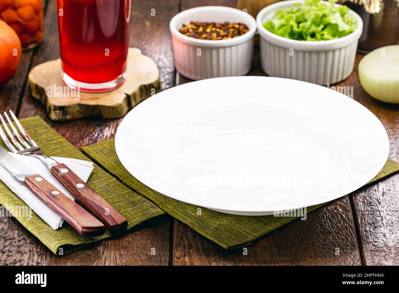 brown color rustic table mockup, top view, empty round and white plate ...