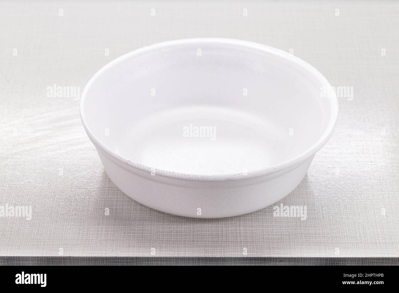 empty styrofoam lunch box mockup, on kitchen table, space for text, copy space, advertising use Stock Photo
