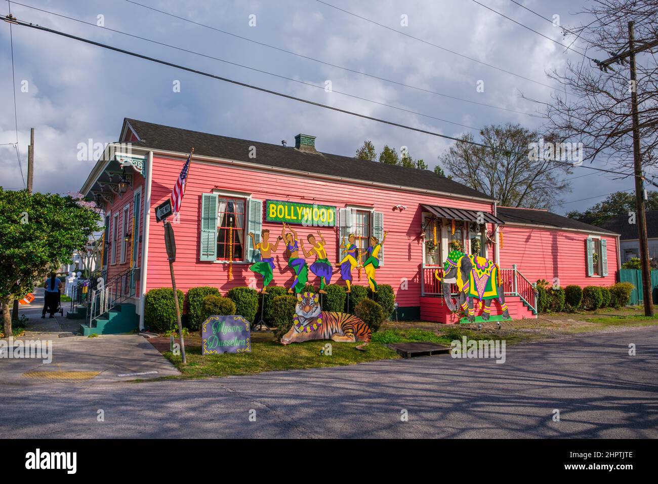 NEW ORLEANS, LA, USA - FEBRUARY 22, 2022: Side view of shotgun house with Bollywood-themed Mardi Gras decorations Stock Photo