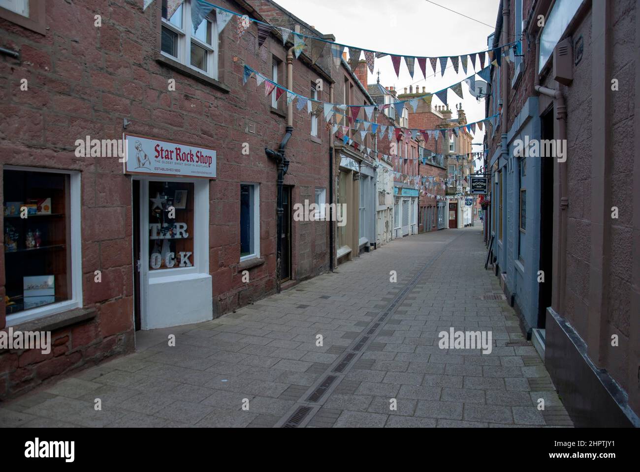 Streetscape Roods Shopping and Residential Street Kirriemuir Angus Scotland United Kingdom landscape view of deserted pedestrianised alley lane close Stock Photo
