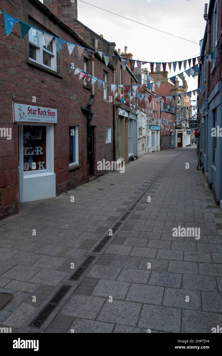Streetscape Roods Shopping and Residential Street Kirriemuir Angus Scotland United Kingdom portrait view of pedestrianised alley lane close walkway st Stock Photo