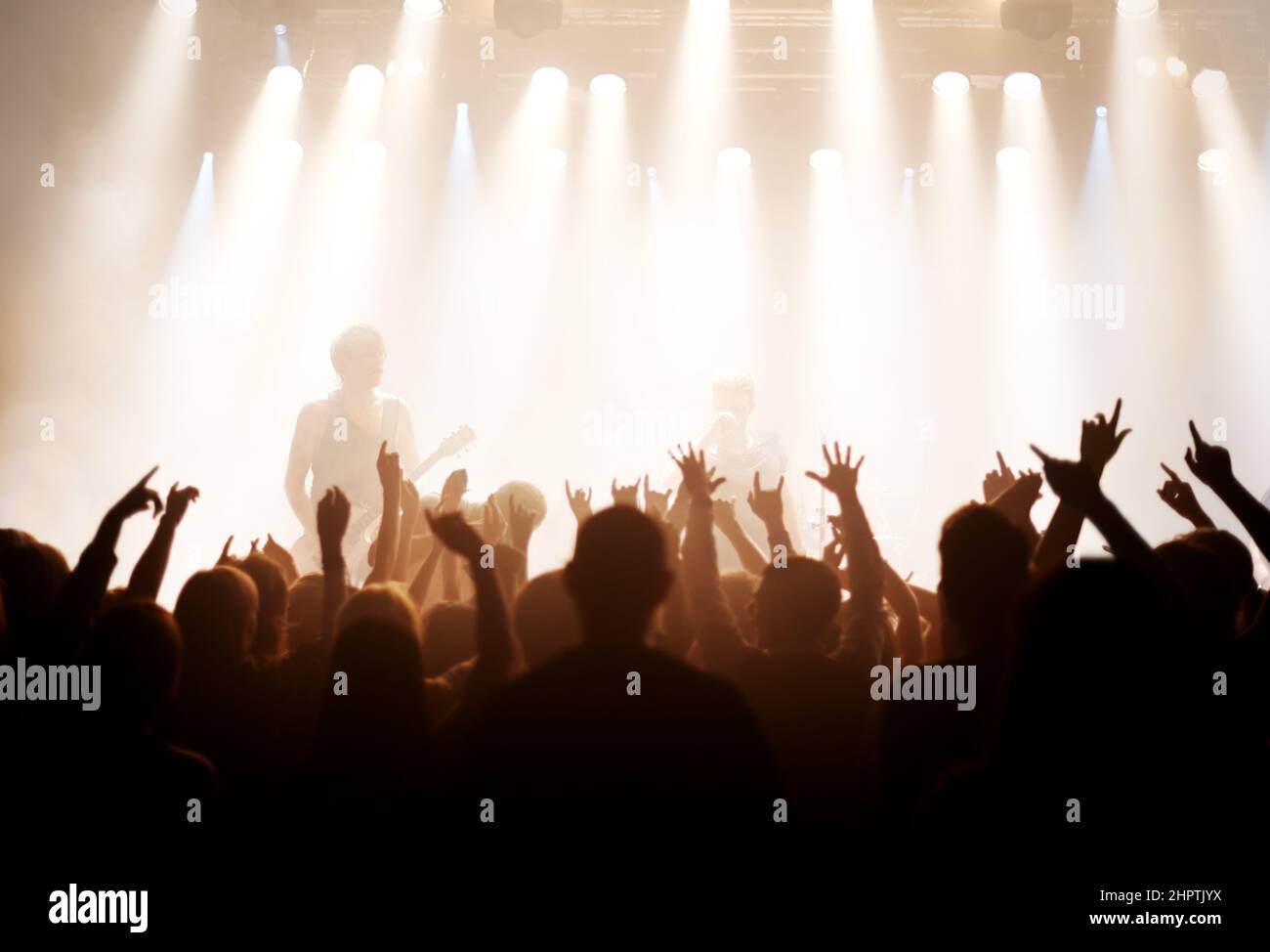 Live music is the only music. Shot of fans enjoying a rock show. Stock Photo