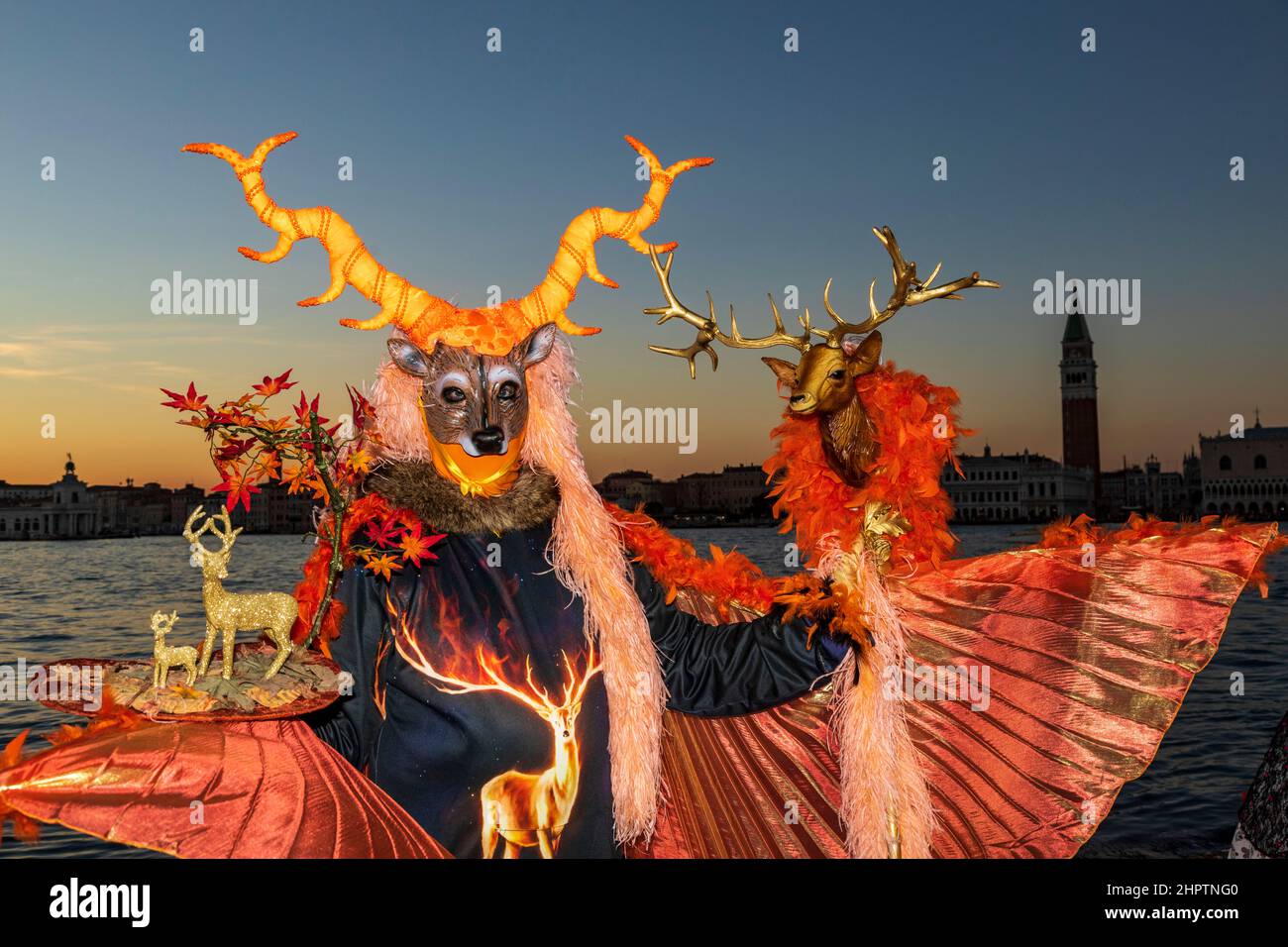 Venice, Italy. 23 February 2022. Carnival in Venice at dusk. Man wearing a Jägermeister costume. Stock Photo