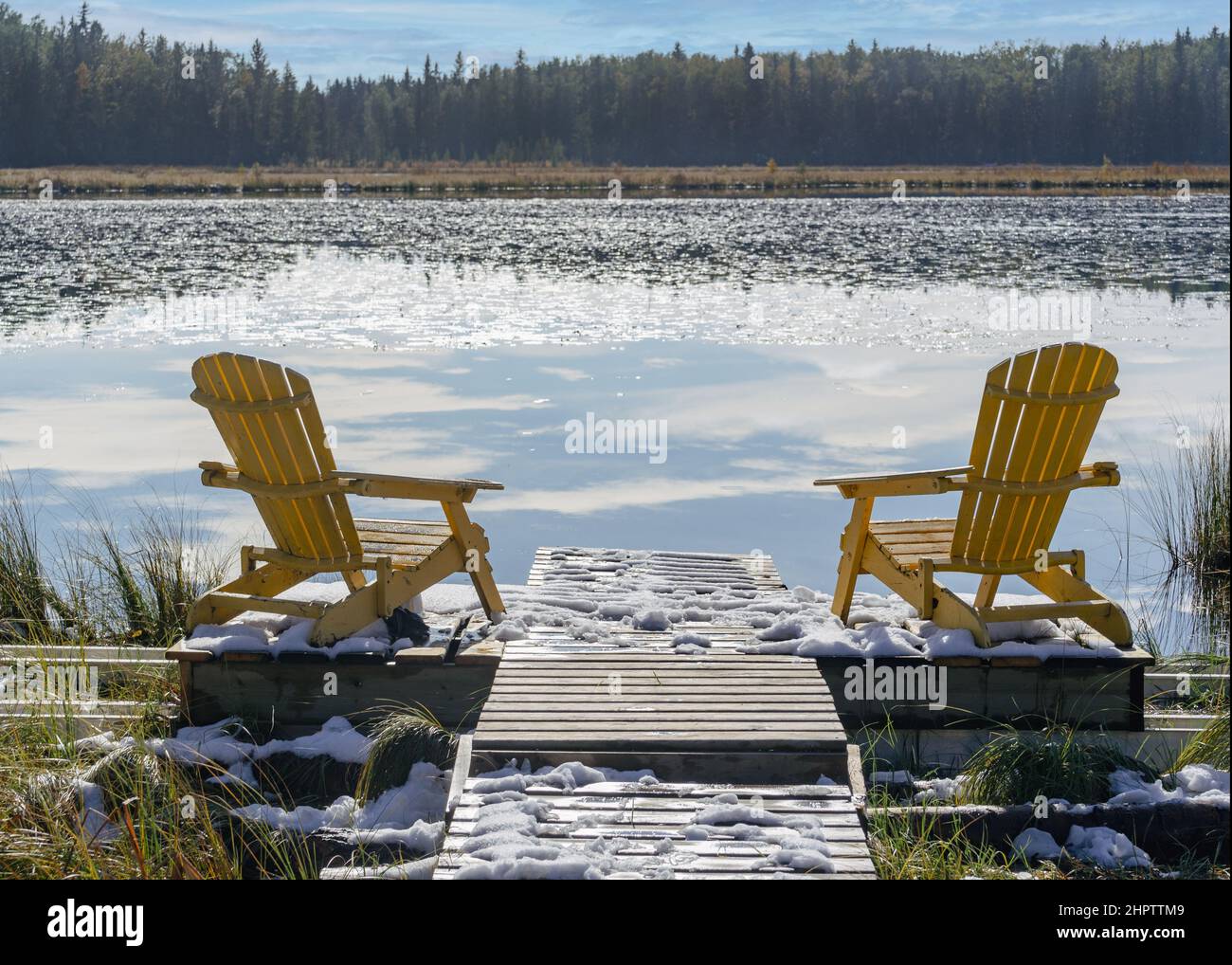 View from a marshy shoreline of an early winter lake. Stock Photo