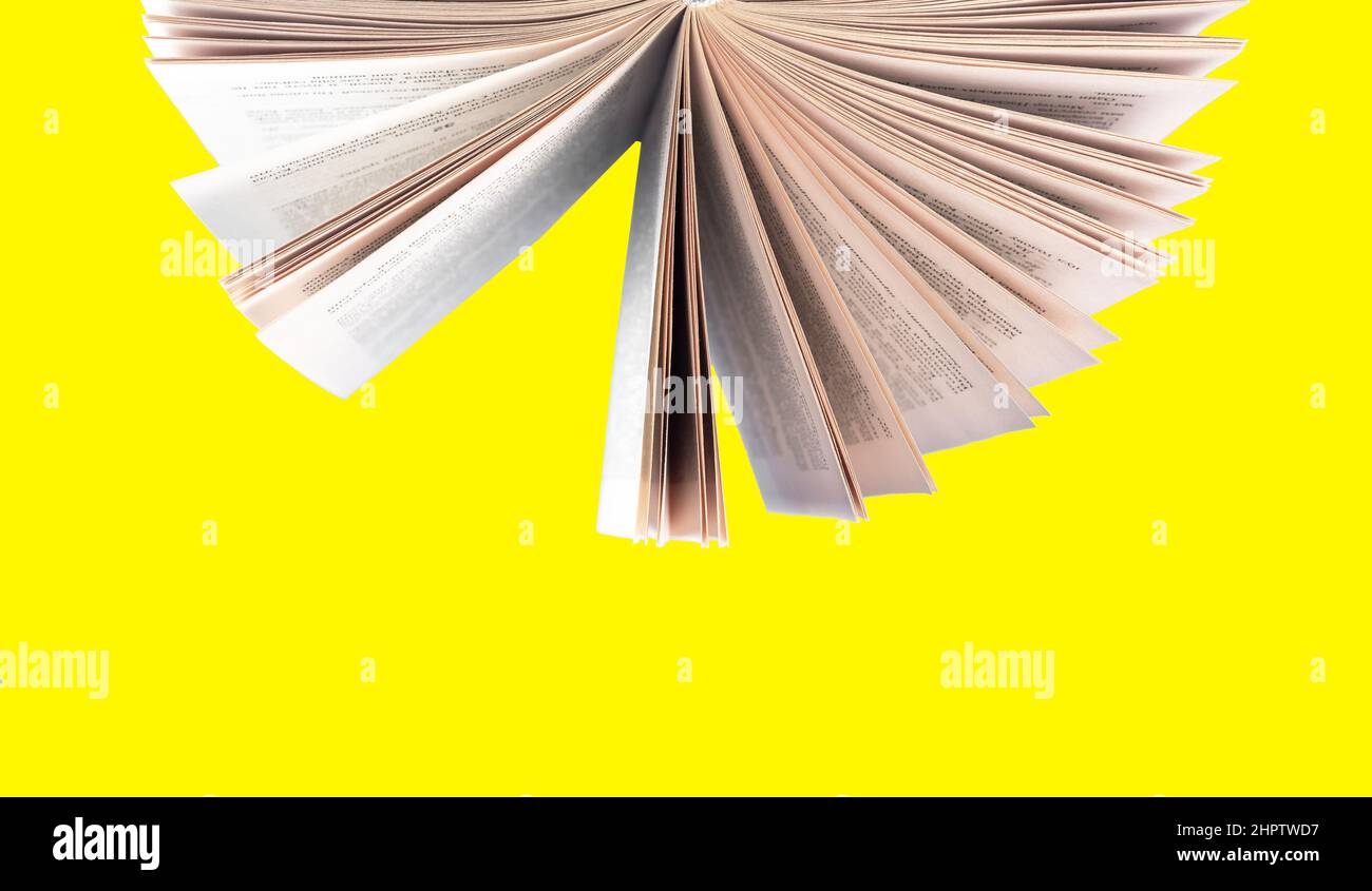 Turning paper book pages on yellow background, photo Stock Photo Alamy