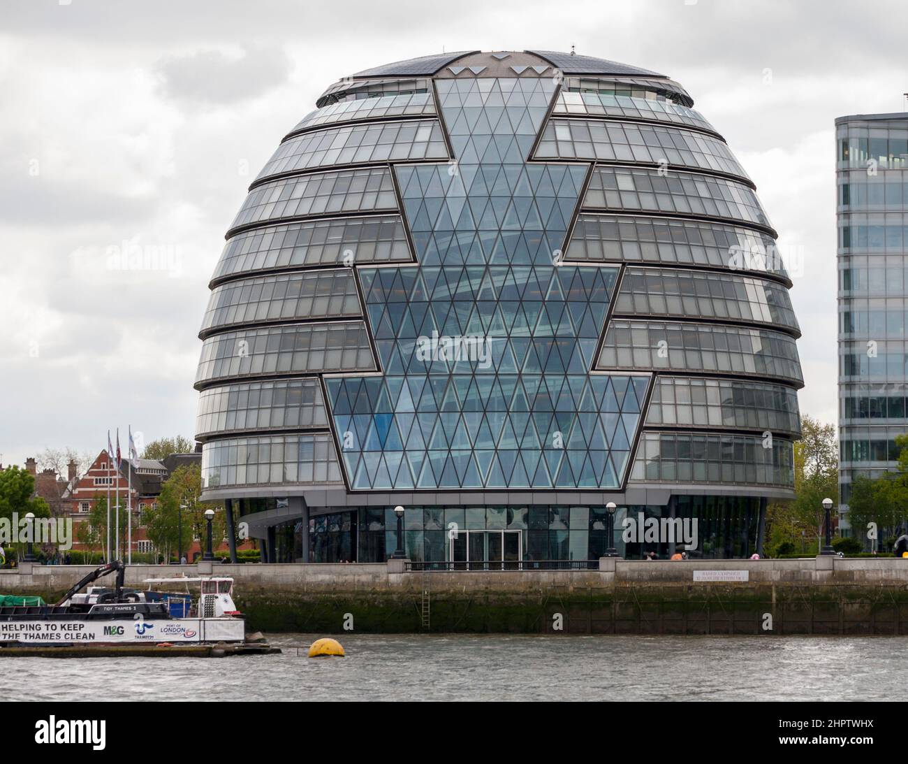 London's 'Glass Egg' by Nornman Foster: The Glass Egg, Sir Norman Foster architect 2002 is planted on the banks of the Thames River in East London. Stock Photo