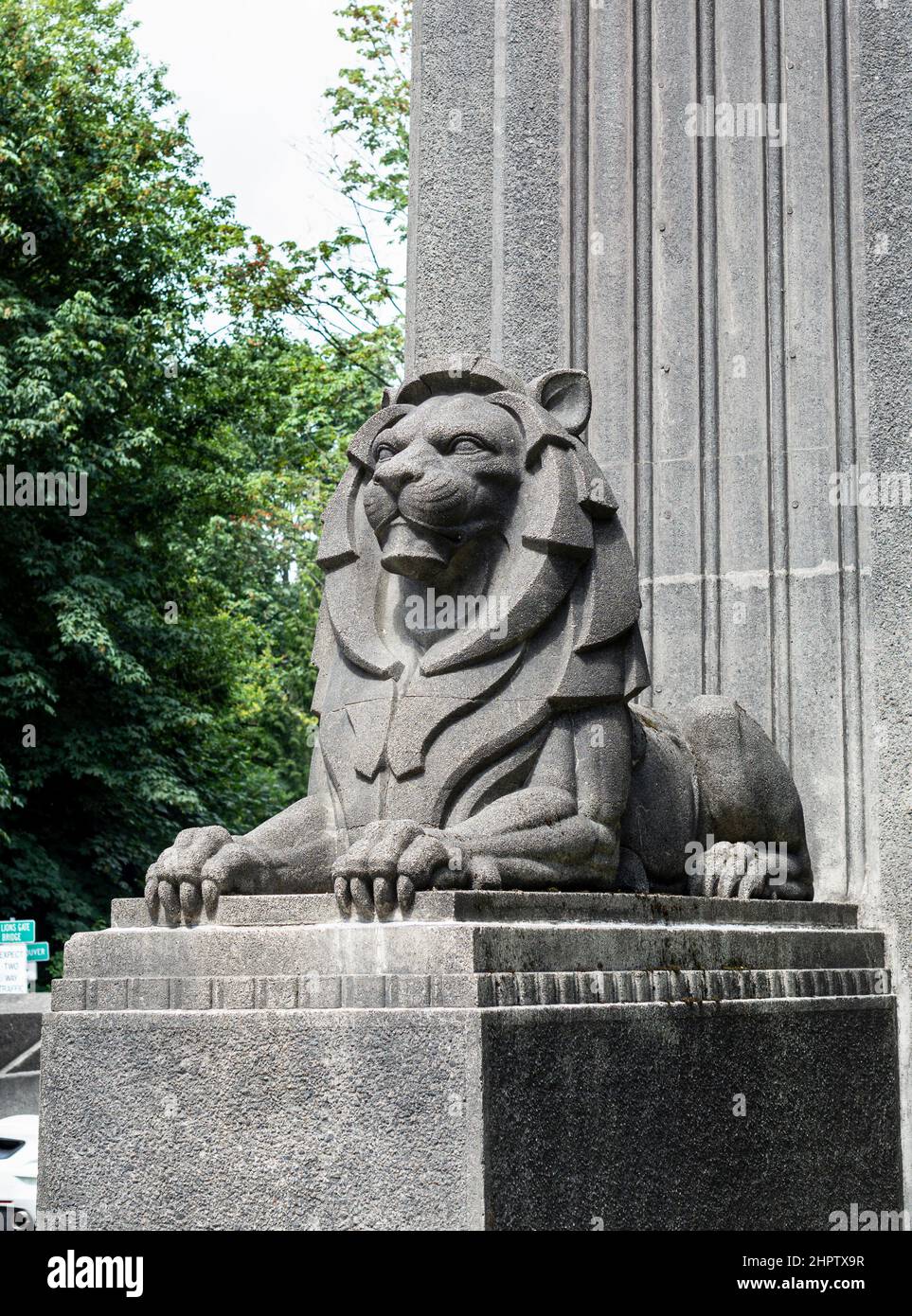 The Lion of the Liion's Gate Bridge: A large sculpture of a lion graces each entrance tower of Vancouver's Lion's Gate Bridge.  This one is on the Stanley Park side. Stock Photo