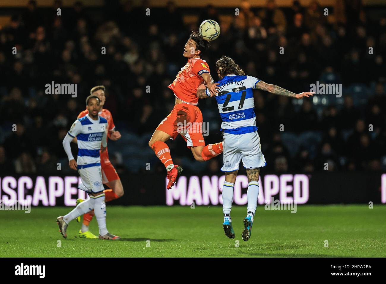 London, UK. 23rd Feb, 2022. Kenny Dougall #12 of Blackpool and Jeff Hendrick #27 of Queens Park Rangers battle for the ball in London, United Kingdom on 2/23/2022. (Photo by Mark Cosgrove/News Images/Sipa USA) Credit: Sipa USA/Alamy Live News Stock Photo