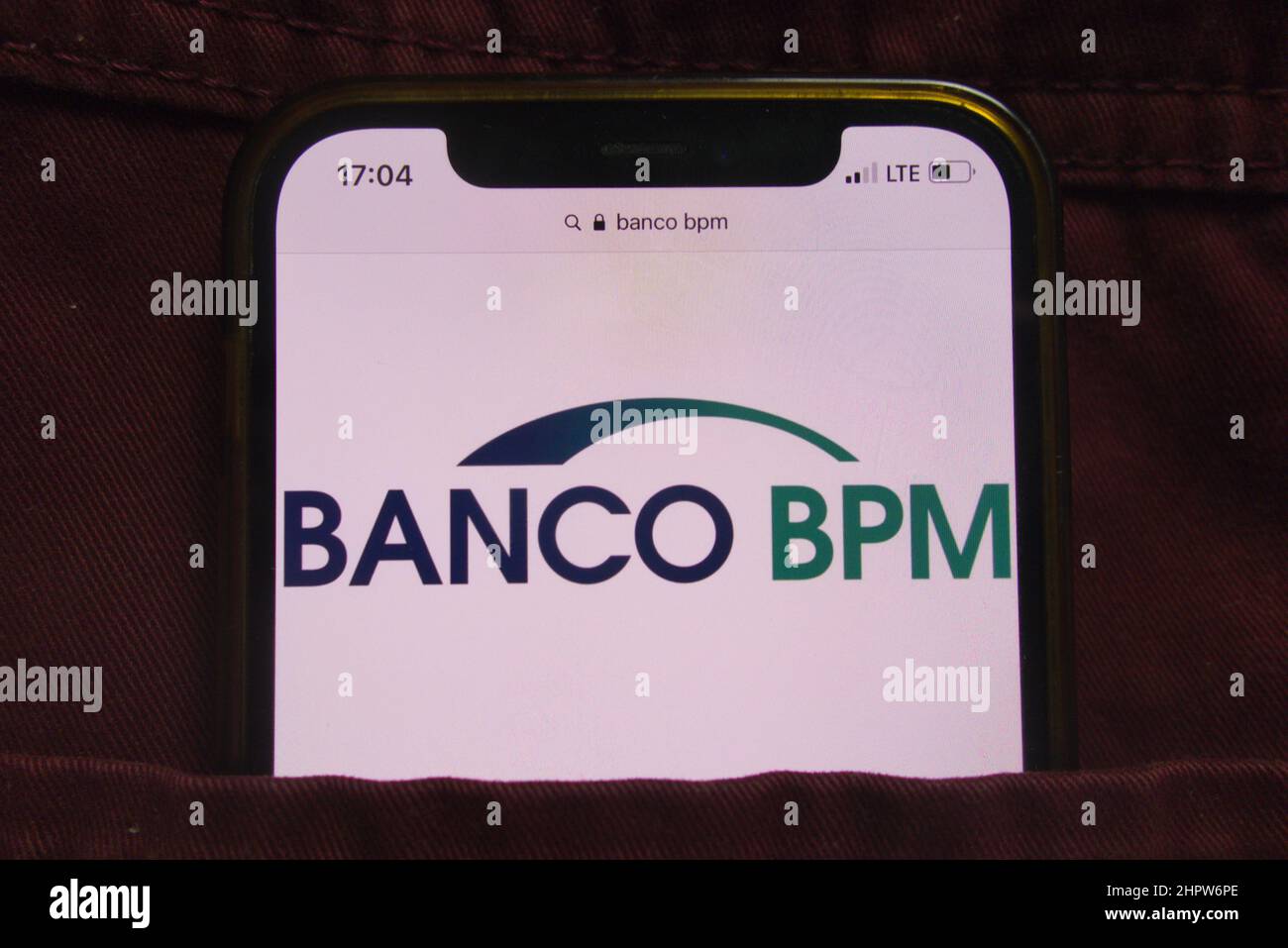 KONSKIE, POLAND - February 22, 2022: Banco BPM SpA logo displayed on mobile phone hidden in jeans pocket Stock Photo