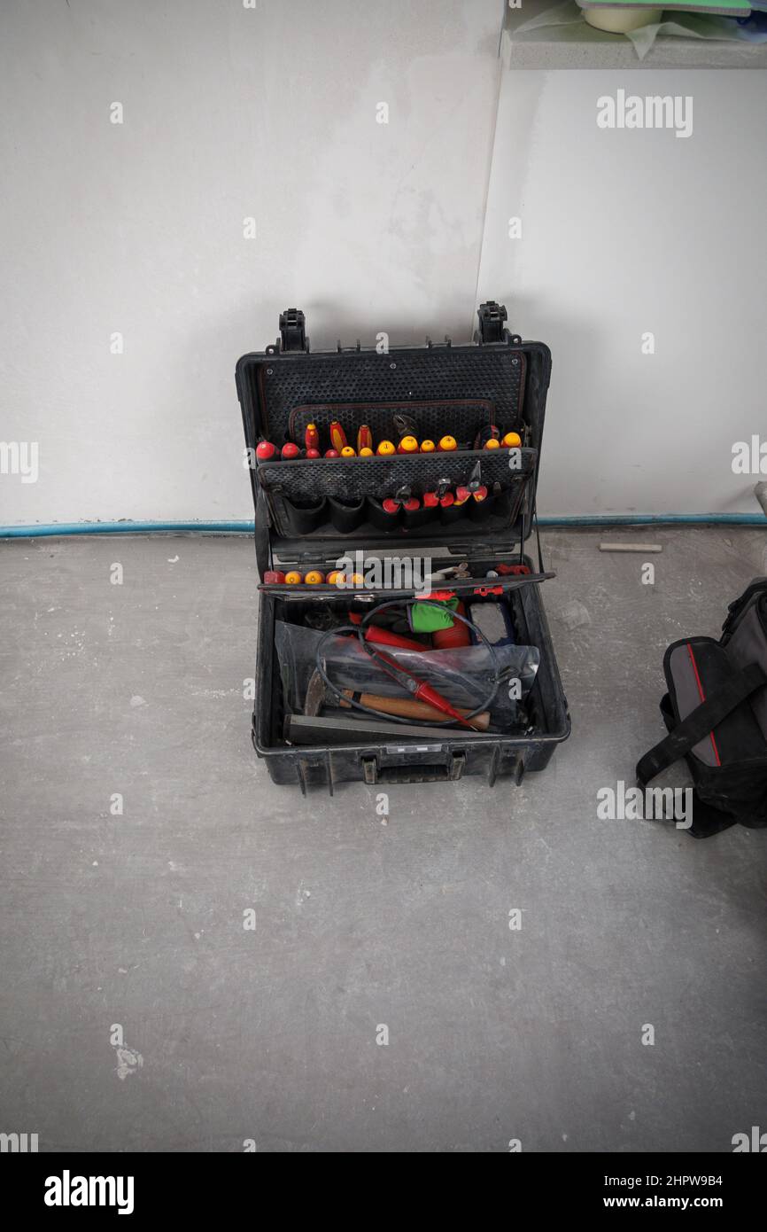 a toolbox stands on the floor of a construction site Stock Photo Alamy