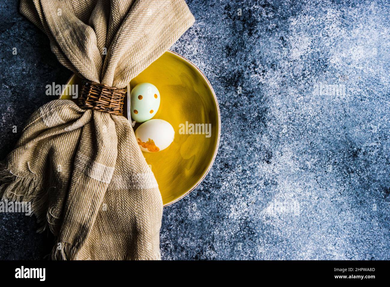 Easter minimalistic place setting on concrete background Stock Photo