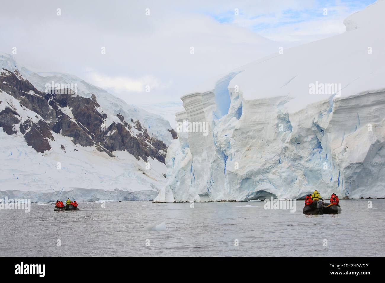 Zodiac boat excursion in Wilhelmina Bay, Antarctica, to view glacier ice face and wildlife. Stock Photo