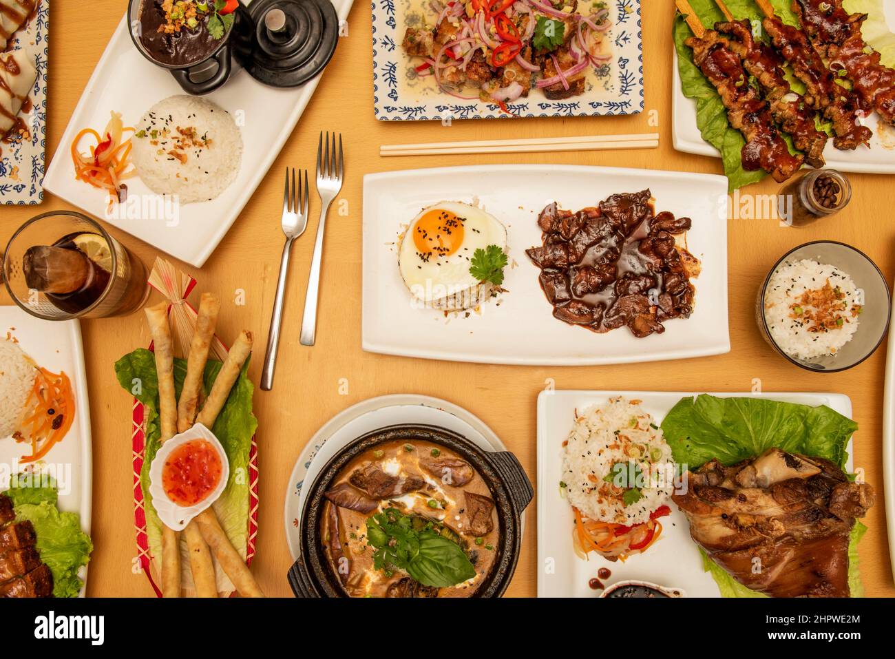 top view image of asian food dishes, tagalog, spring rolls, roast beef