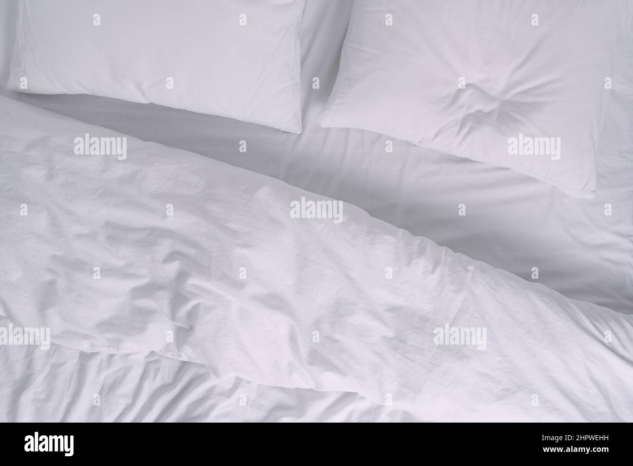 Top view of white bed with pillows Stock Photo