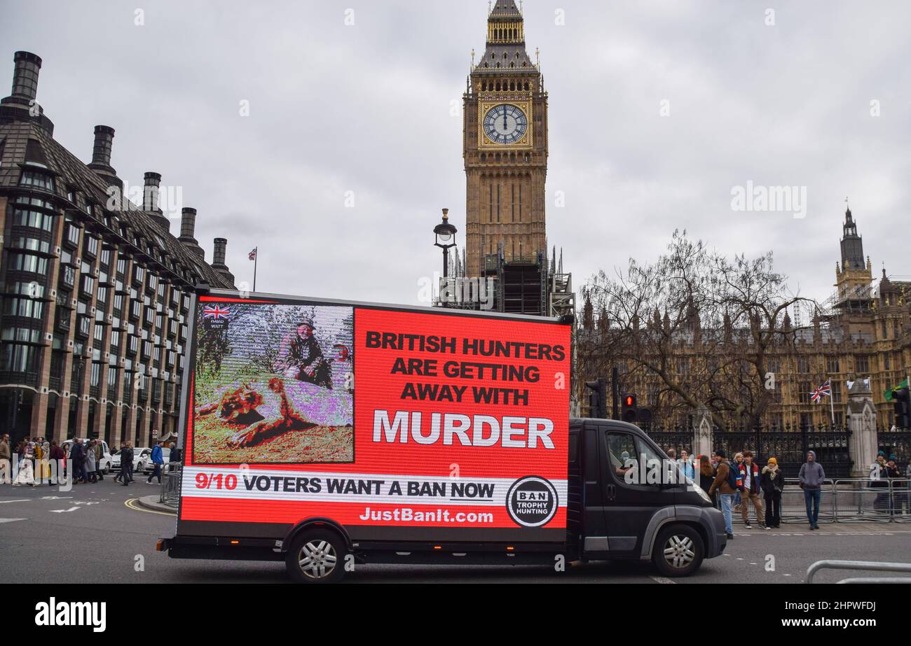 London, UK. 23rd February 2022. A mobile electronic display with a message from Campaign To Ban Trophy Hunting passes through Parliament Square. Credit: Vuk Valcic/Alamy Live News Stock Photo