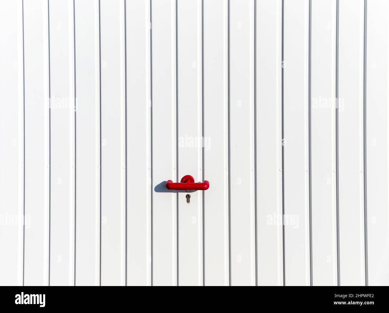 locked door at a parking garage with red handle Stock Photo Alamy