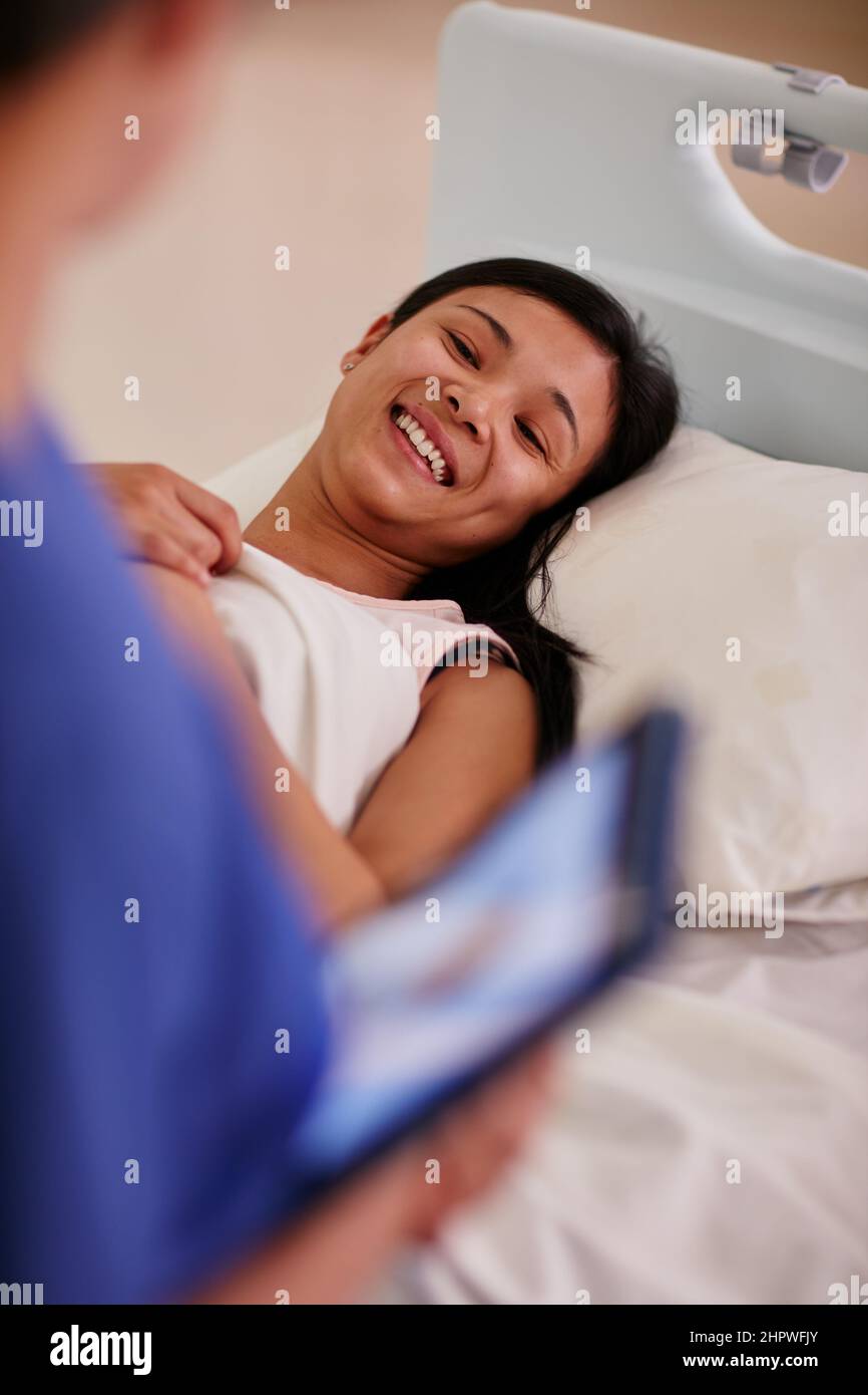 Get professional care. Cropped shot of a patient talking to her nurse. Stock Photo