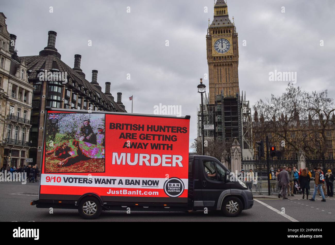 London, UK. 23rd February 2022. A mobile electronic display with a message from Campaign To Ban Trophy Hunting passes through Parliament Square. Credit: Vuk Valcic/Alamy Live News Stock Photo