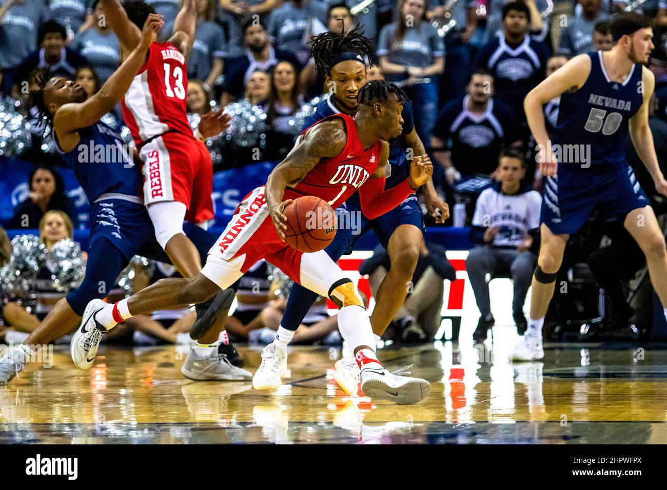 Reno, United States. 22nd Feb, 2022. Las Vegas Guard #1 Michael Nuga tries to find an opening in Reno's defense during the University of Las Vegas vs University of Nevada Reno match at Lawlor event centre and University of Las Vegas came out victorious, 62 to 54. Credit: SOPA Images Limited/Alamy Live News Stock Photo