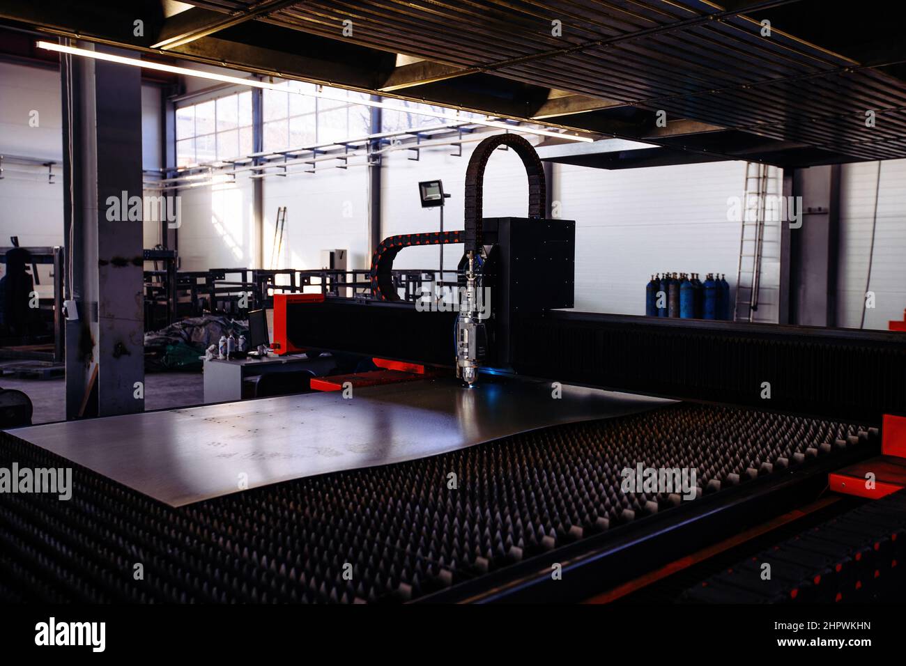 Laser cutting machine with CNC is cutting the steel sheet Stock Photo