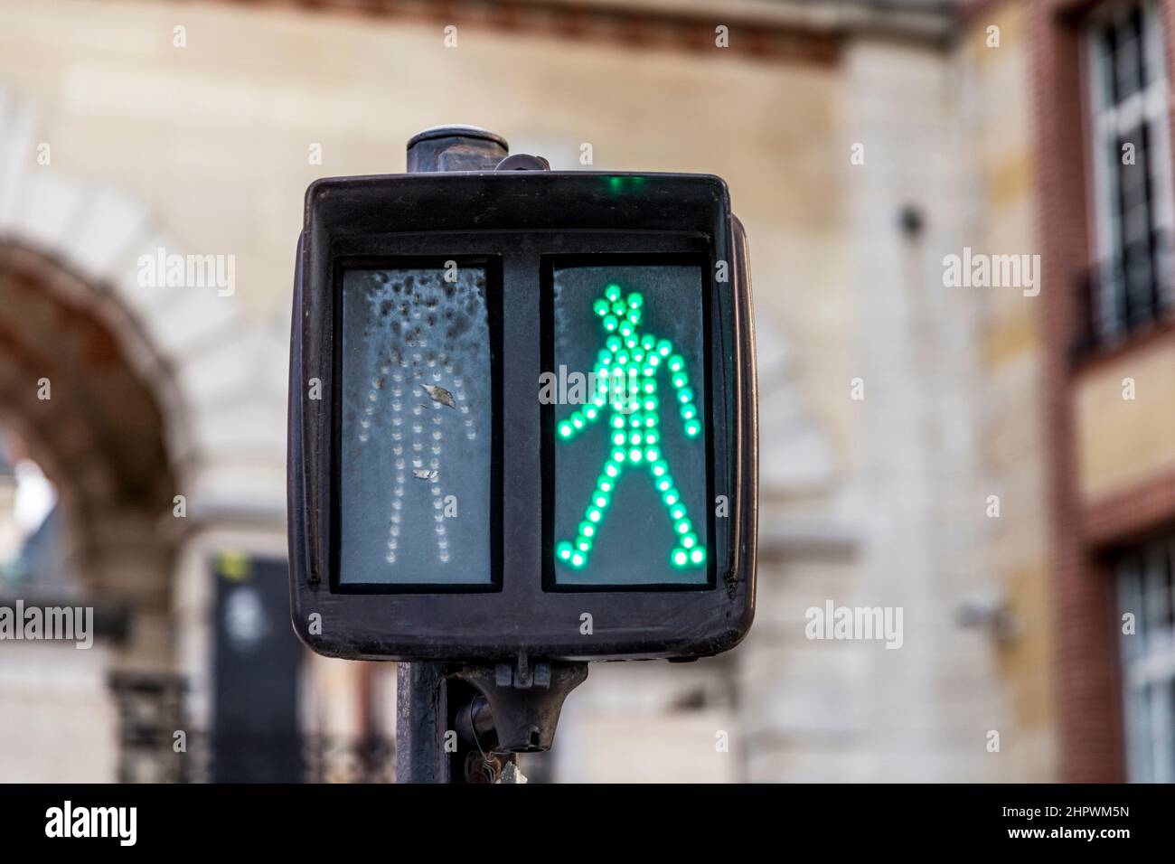 green man at traffic light shows right to walk over the pedestrian crossing way Stock Photo