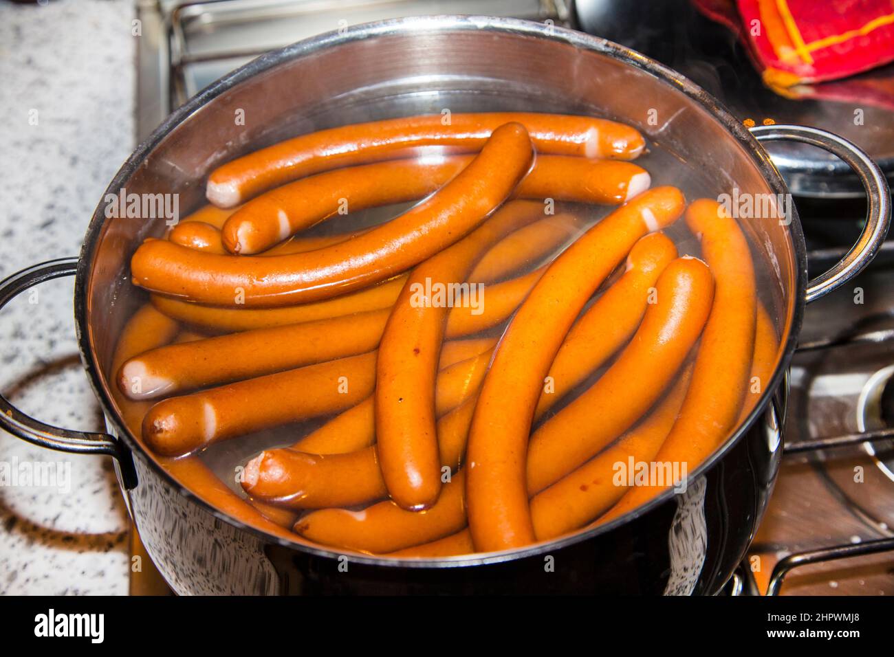 Boiling Susage sausages are boiling in a pot of water Stock Photo - Alamy