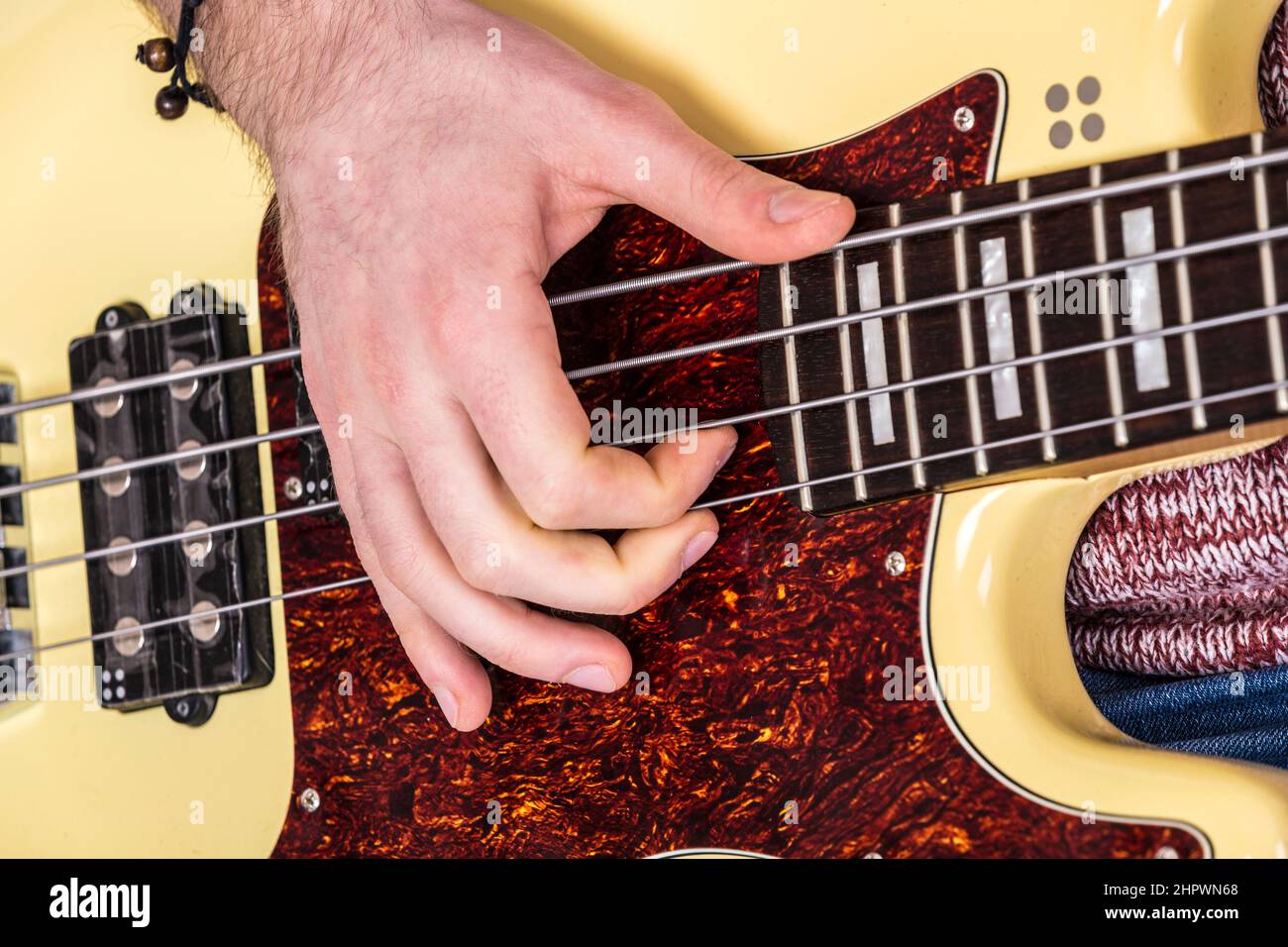 detail of man playing bass guitar Stock Photo Alamy