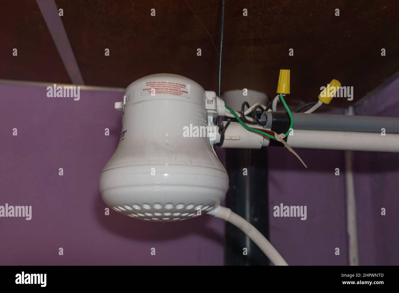 Point of use heated showerhead hires stock photography and images Alamy