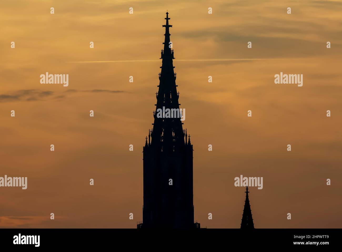 Ulm Cathedral, sunset, orange sky, left the west tower, main tower, right east tower, Ulm, Baden-Wuerttemberg, Germany Stock Photo